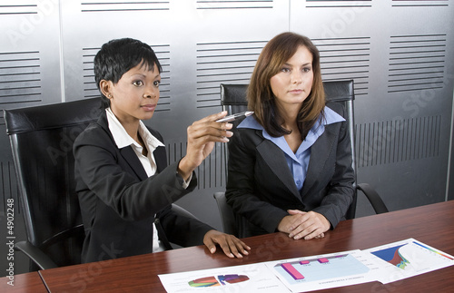 Two female business graph photo