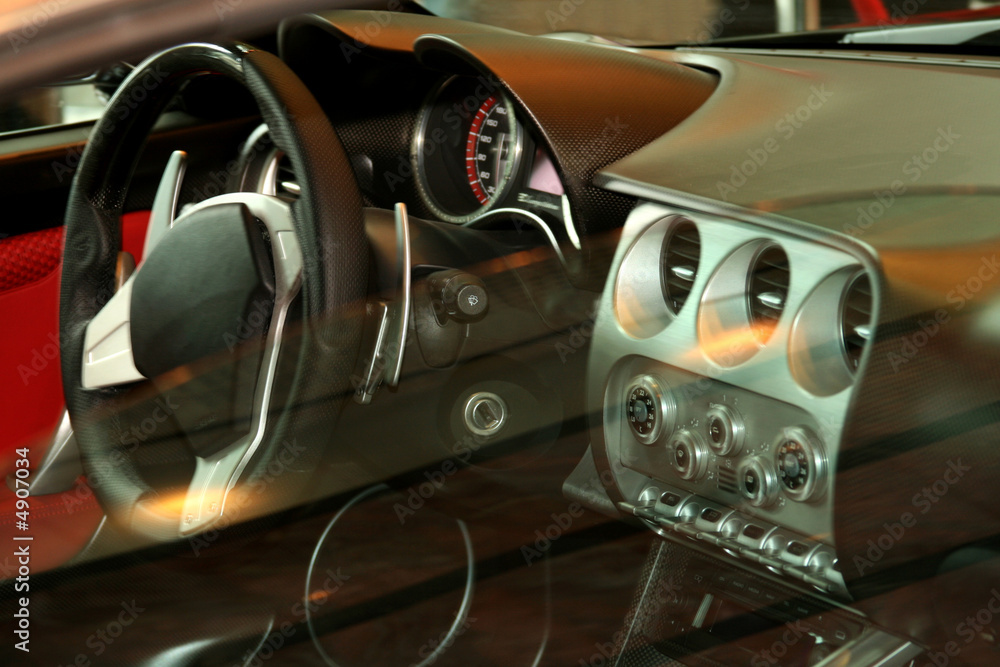 Fototapeta premium looking at a car dash and steering wheel through the passenger w