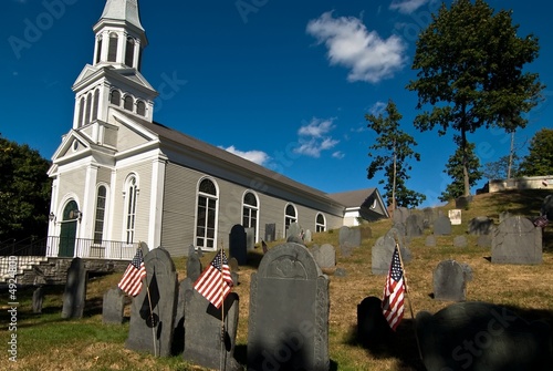 View of a cemetery with a church in the background