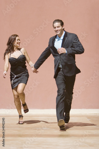 Happy couple running