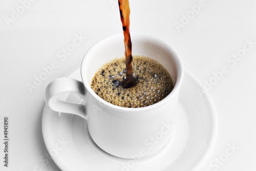 Canvas Print Pouring a cup of coffee