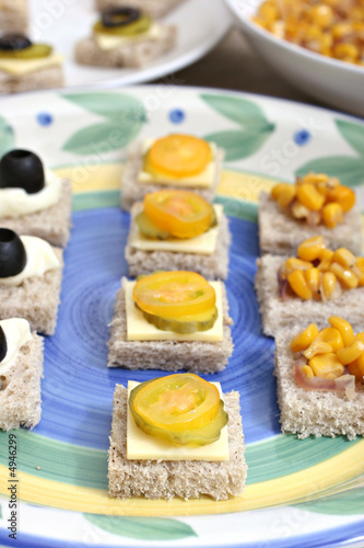 Fruit and vegetable canapés on a white ceramic plate