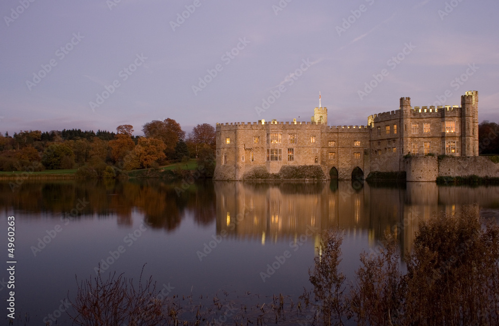 Old English Castle and lake at sunset