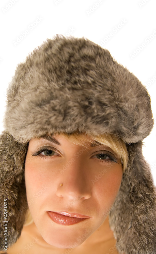 Funny girl in fur-cap isolated on white background Funny girl in fur-cap isolated on white background