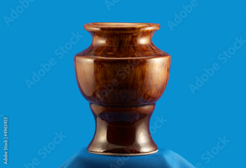 Stylish vase from tea set on blue