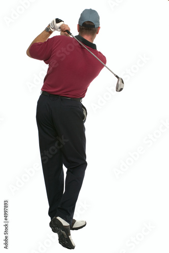 Golfer back swing rear view