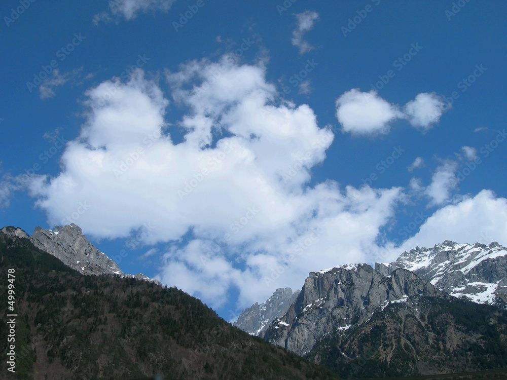 Fototapeta premium Blue sky over Swiss Alps with a hint of snow