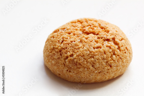 single amarettini cookie on white