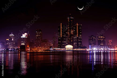 view of Detroit skyline at night and moon, Michigan