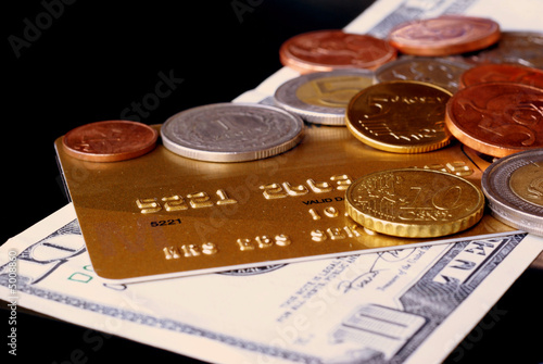 Gold card, dollars and coins photo