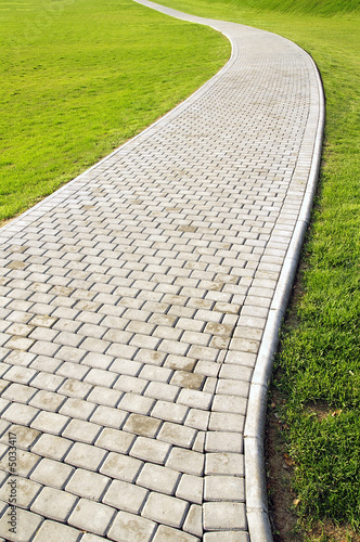 Curved path and green grass