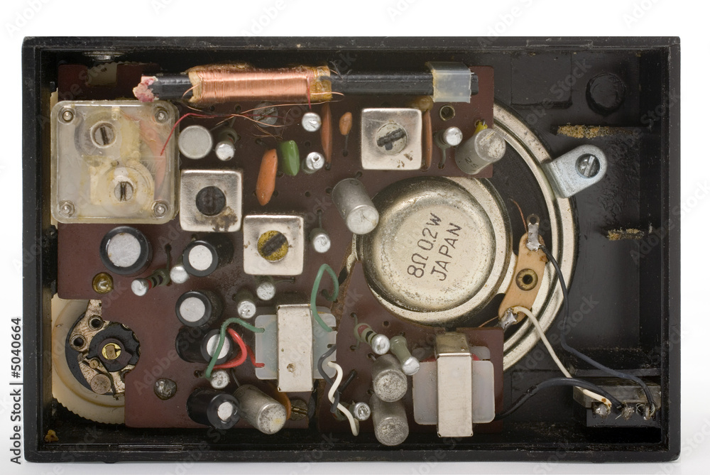 inside an old black pocket radio Photos | Adobe Stock