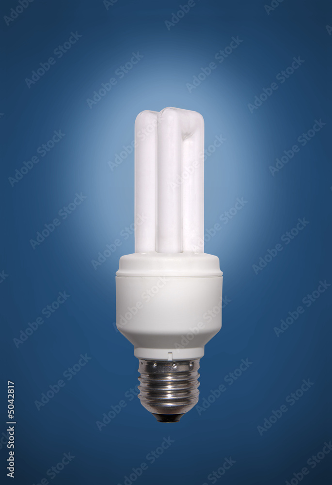 Energy saving lamp on blue background. Energy saving lamp on blue background.