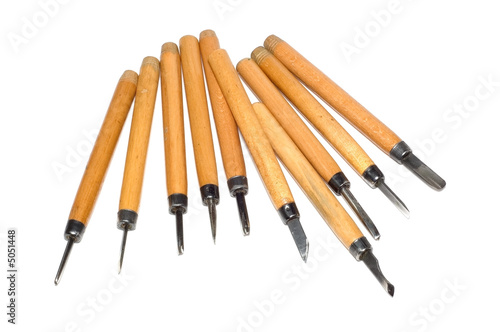 Set of chisels on a tree isolated on a white background.