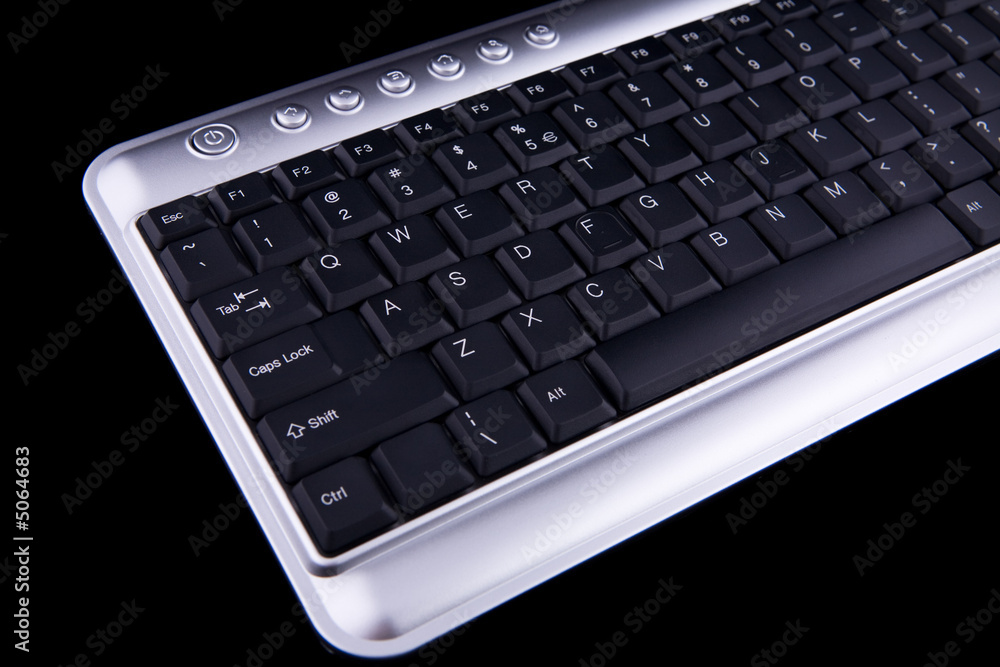 Computer keyboard on black background Computer keyboard on black background