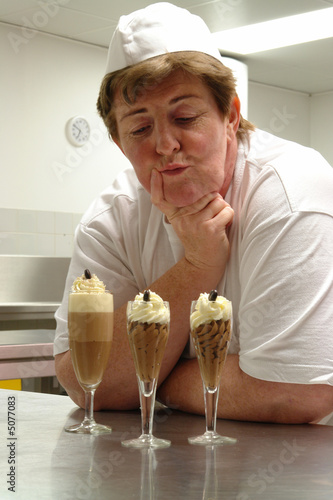 Cook presenting desserts