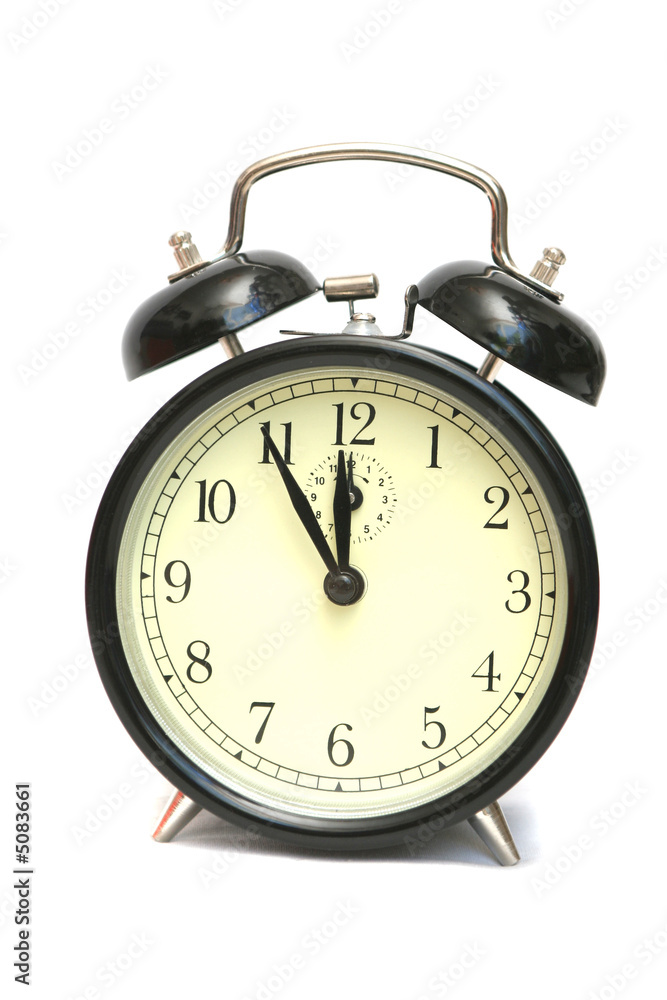 The black alarm clock is isolated on a white background The black alarm clock is isolated on a white background
