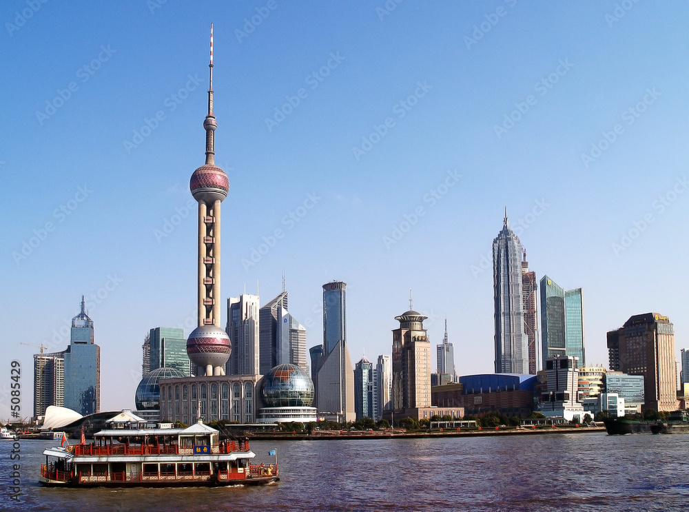 Fototapeta premium Shanghai - Skyline and traditional chinese boat