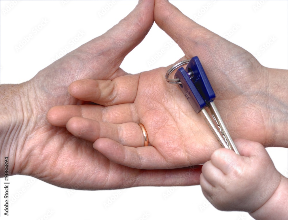 Baby gives keys to parents' hands Baby gives keys to parents' hands