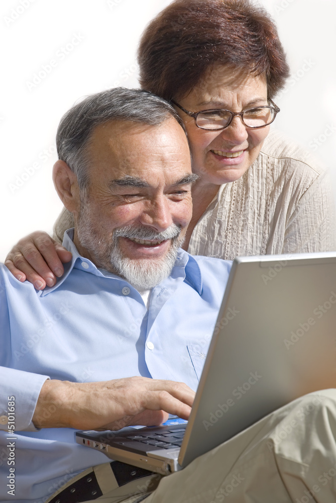 Senior couple on laptop. Concept may be is shopping in internet.