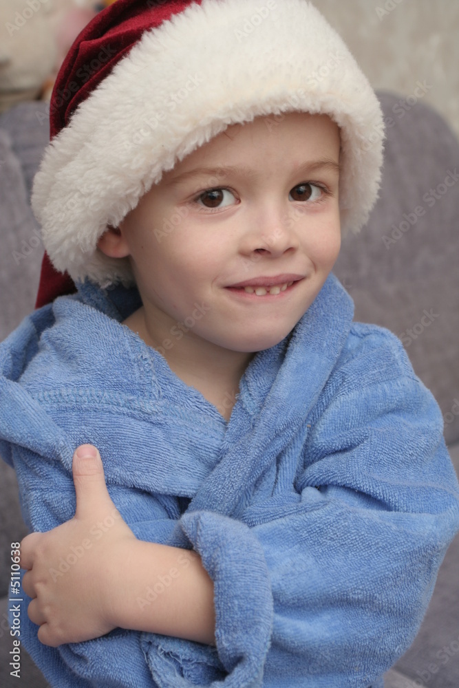 The cheerful boy in a New Year's cap The cheerful boy in a New Year's cap