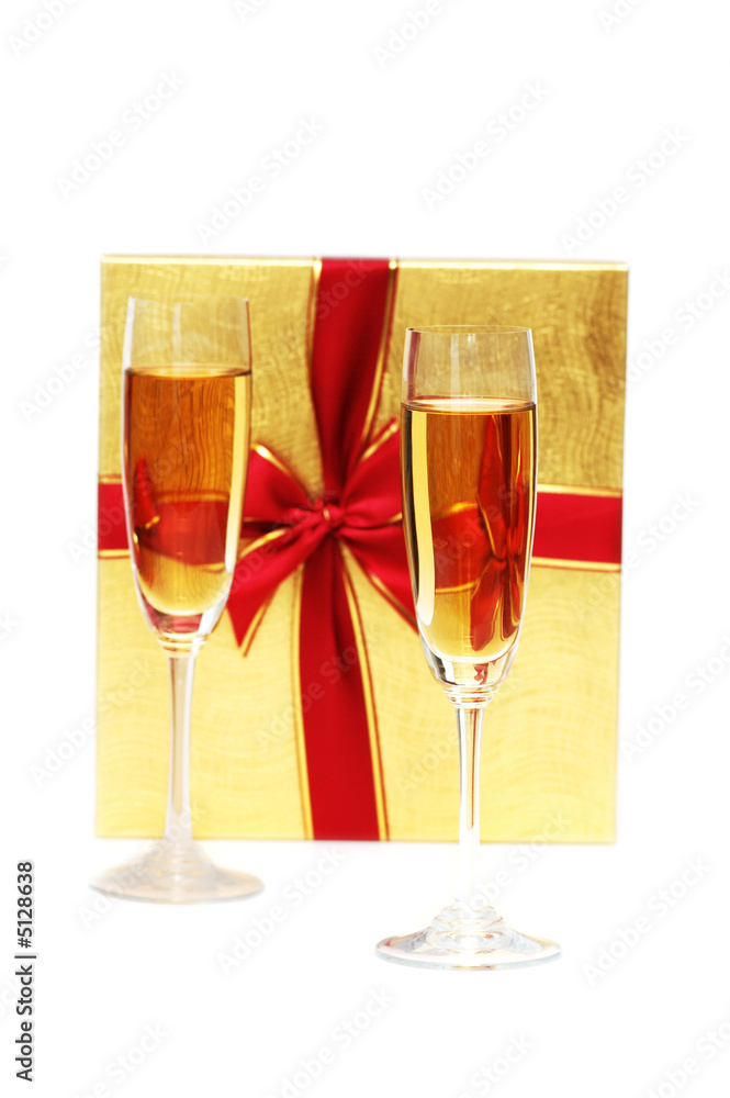 Giftbox and champagne isolated on the white Giftbox and champagne isolated on the white