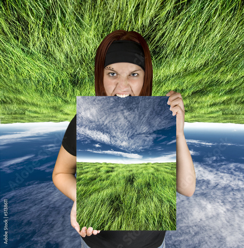 Angry girl holding a nature canvas