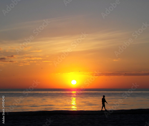 walking on the florida beach at sunset © J Hindman