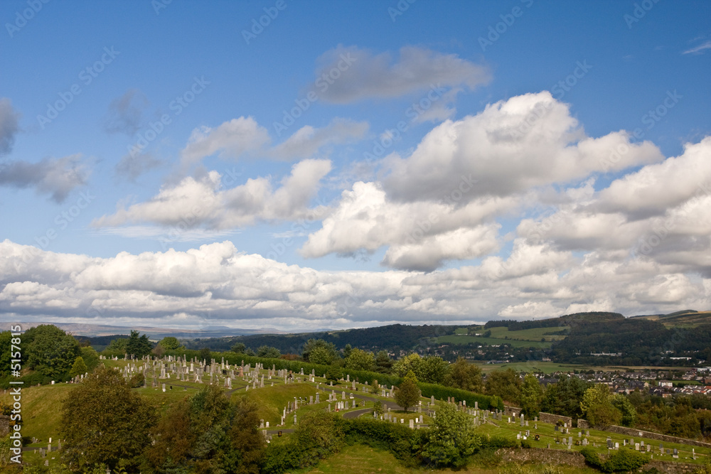 Stirling cemetery under a cloudy sky
