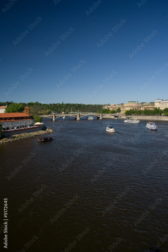 Prague river Vltava, bridge and ships view from Charles