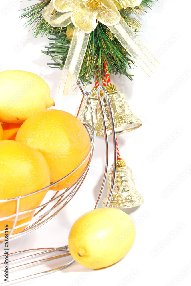 Chrictmas decoration bells and citus fruits  