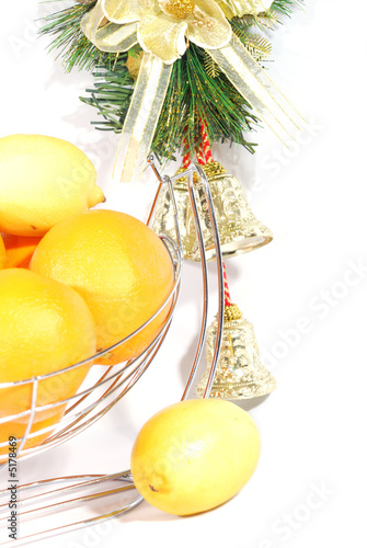 Chrictmas decoration bells and citus fruits   photo