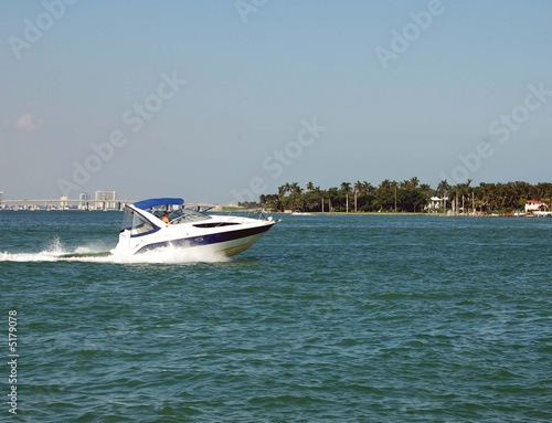 White Blue and Gold Cabin Cruiser