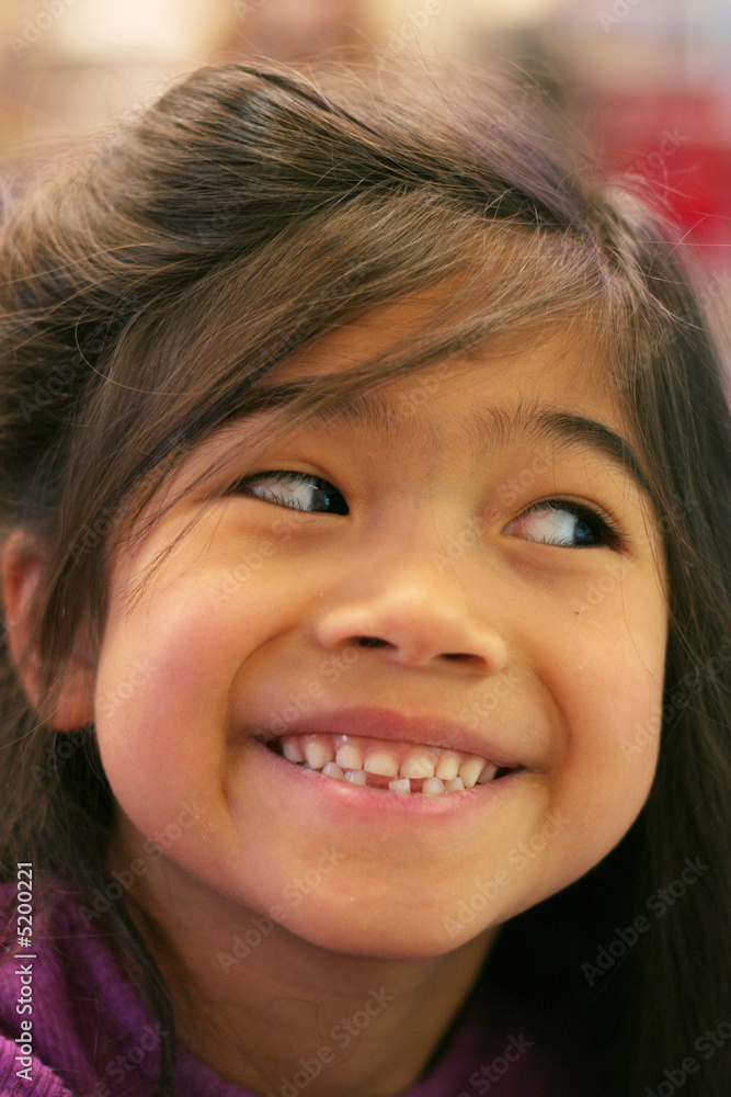 Seven year old girl proudly showing her loose tooth. Seven year old girl proudly showing her loose tooth.