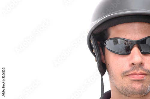 Latino motorcycle man with helmet and sunglasses © roxxyphotos