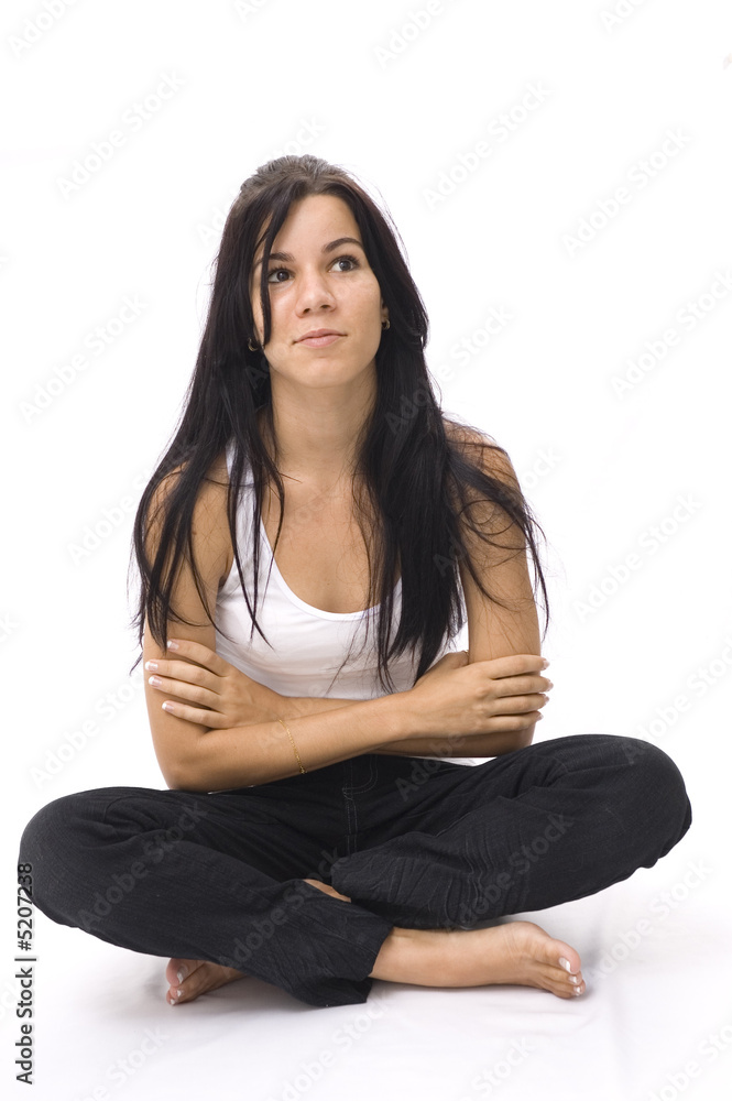 Portrait of hispanic teen girl sitting on the floor - isolated Portrait of hispanic teen girl sitting on the floor - isolated