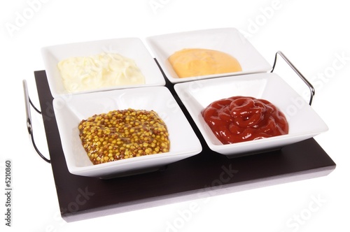 four sauces in white dishes