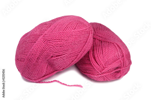 Two skeins of red wool yarn.