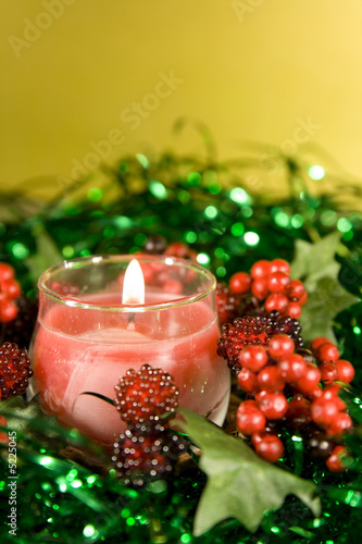 Christmas decorations with lit Candle