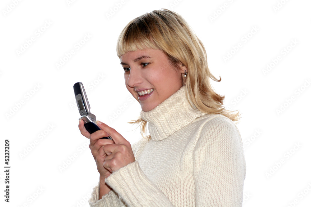 Young blond woman sms by mobile phone. She is happy Young blond woman sms by mobile phone. She is happy