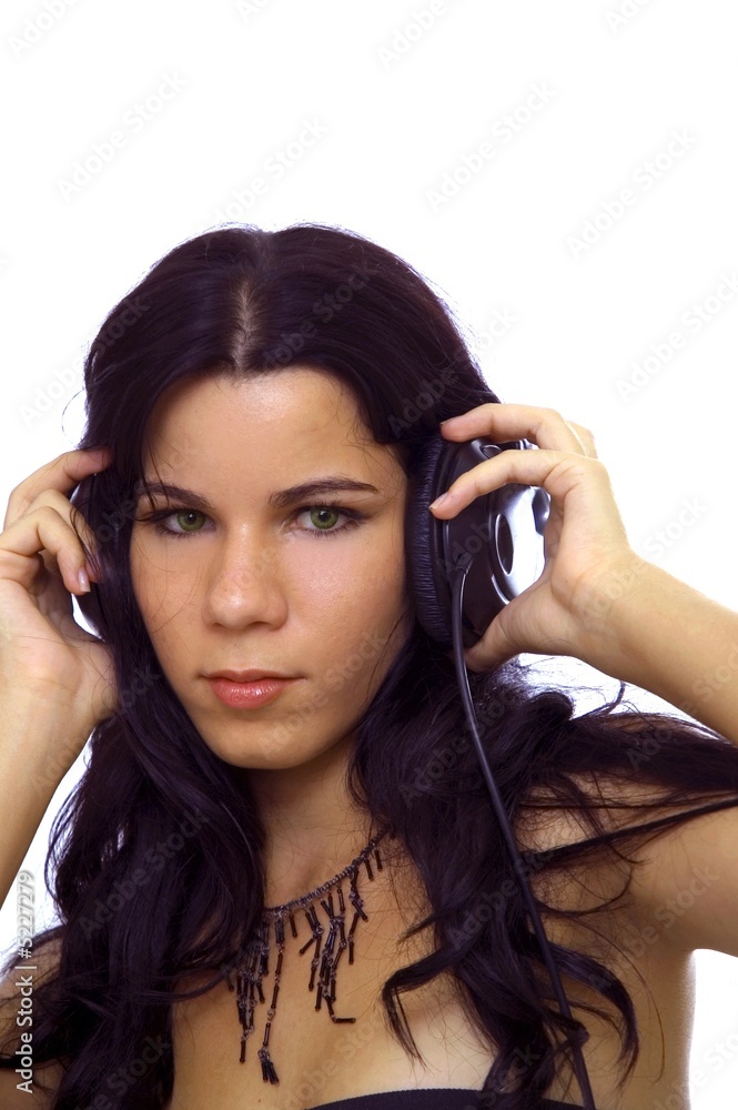 Girl and music - young girl with headphones isolated Girl and music - young girl with headphones isolated
