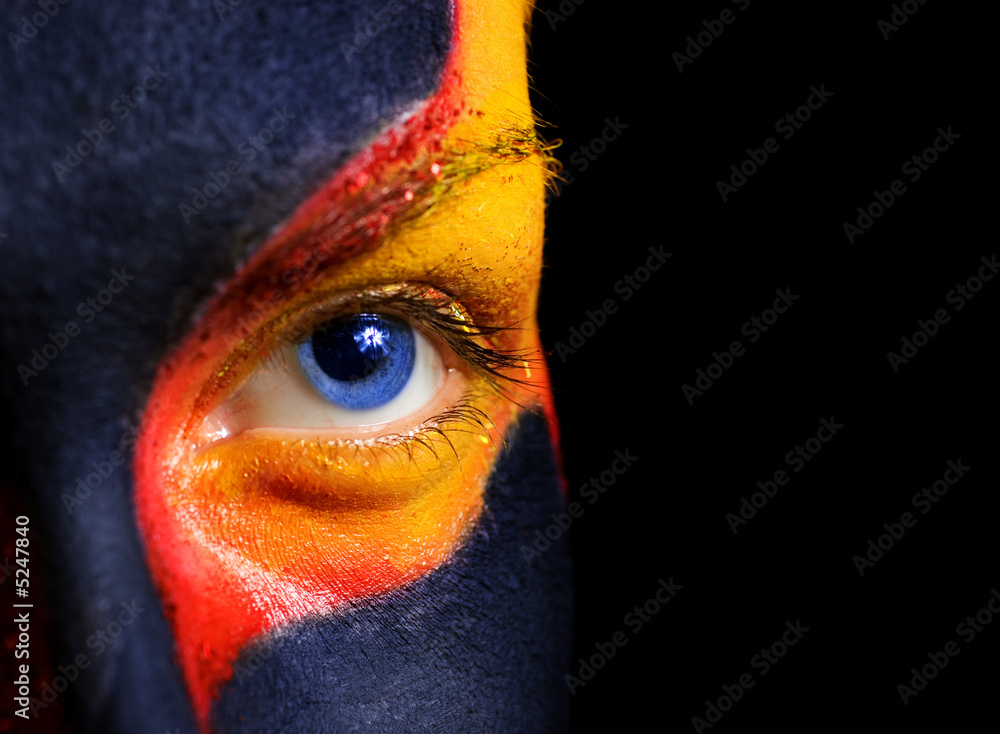 Naklejka premium Portrait of a mysterious woman with artistic make-up on her face