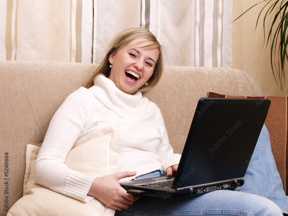 Smiling female student on the sofa. Smiling female student on the sofa.