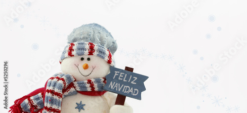 muñeco de nieve con un letrero de feliz navidad