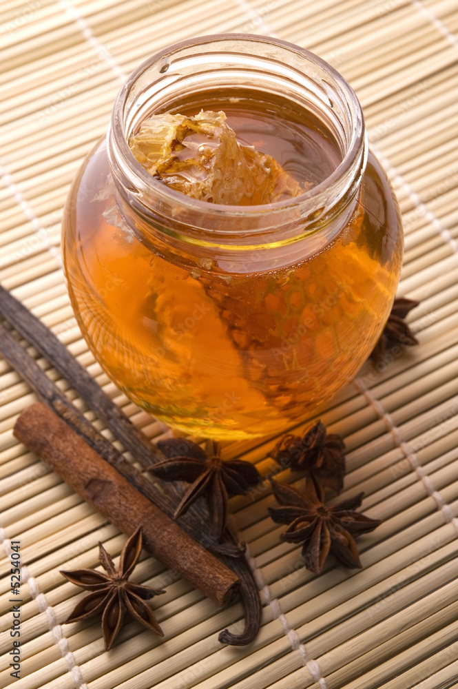 Fototapeta premium fresh honey with honeycomb and spices