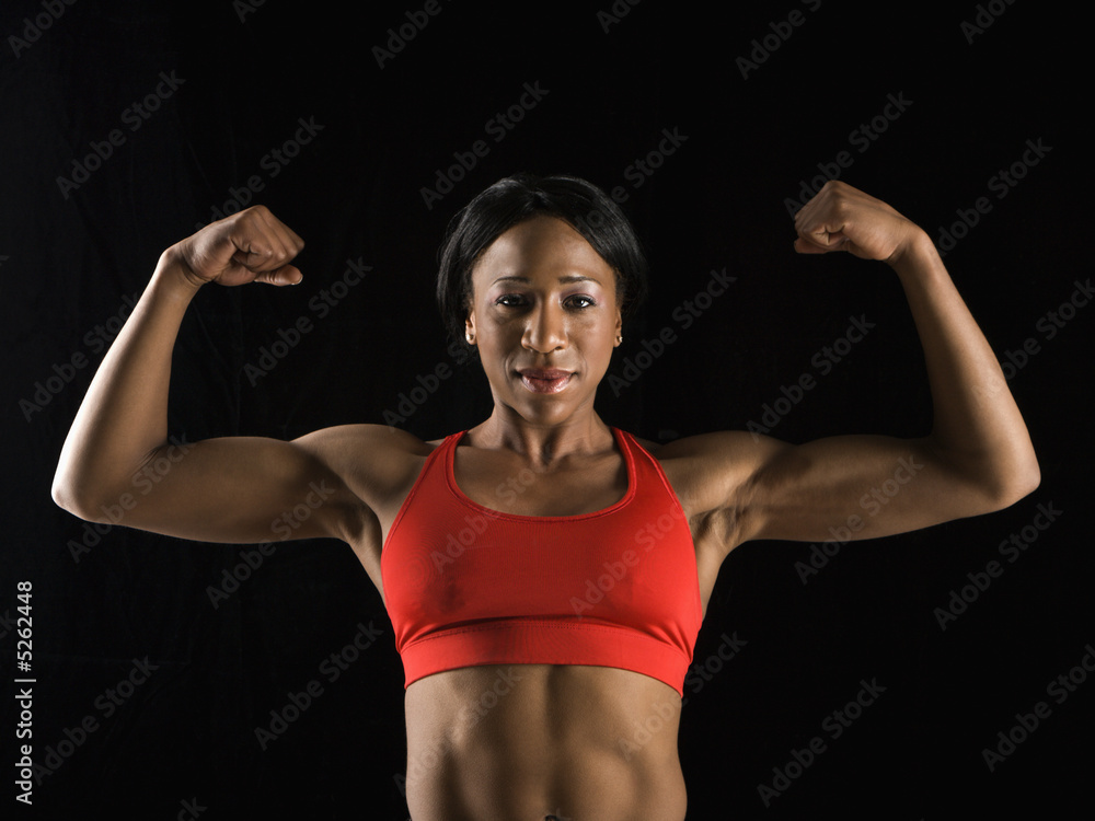 Woman flexing muscles. Woman flexing muscles.