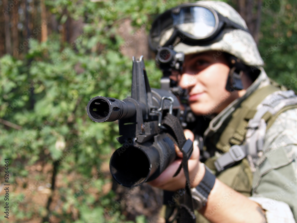 Fototapeta premium Soldier aiming with M4 carbine