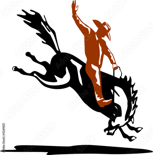 Rodeo cowboy riding a bucking bronco