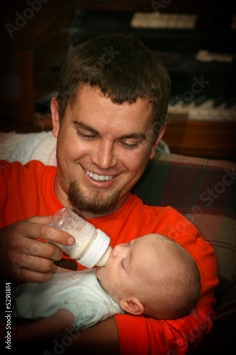Dad feeding Baby