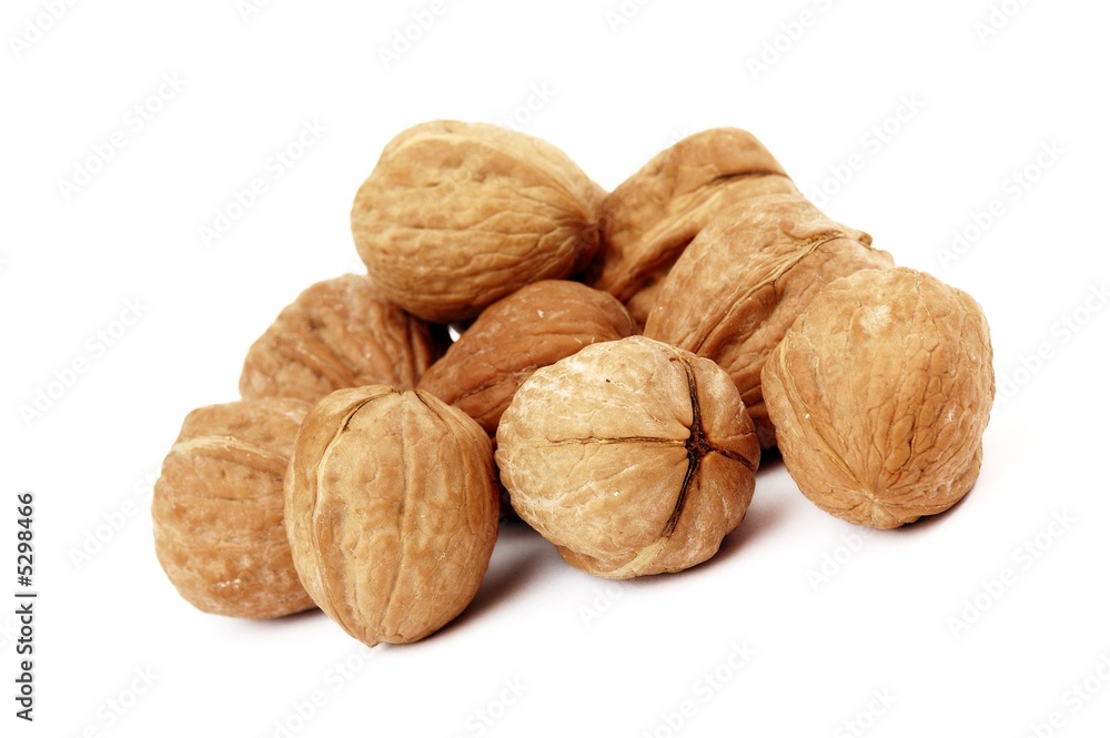 several walnuts on white background several walnuts on white background